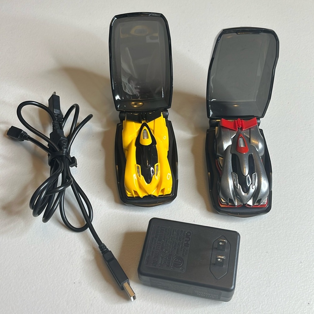 Anki Overdrive Boson gray and red car and yellow and black car w/charger & pods